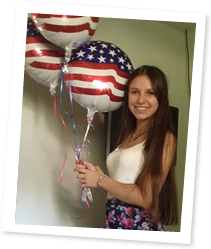 ASSE Exchange Student Holding Balloons from Host Family